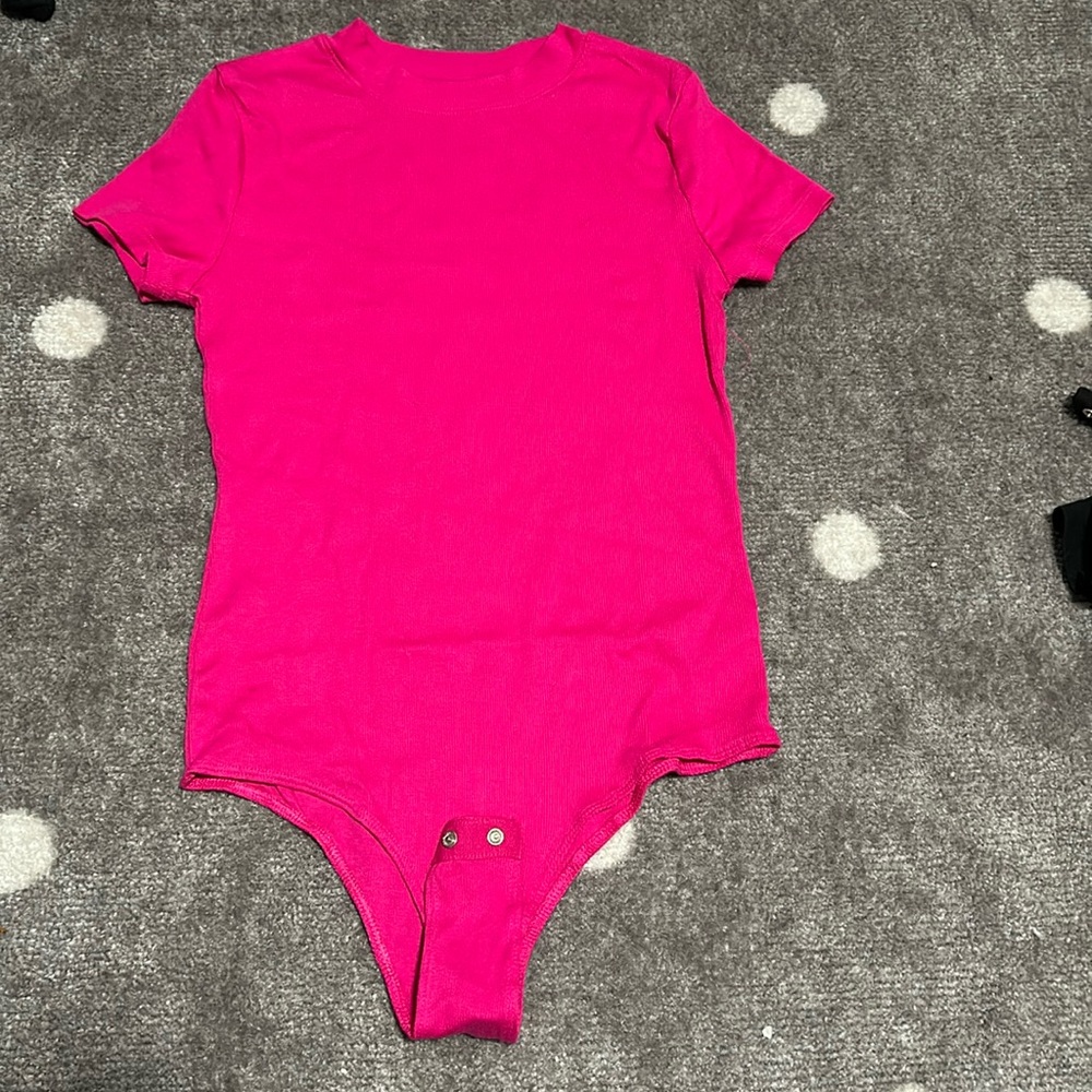 Hot pink body suit and black bodysuit